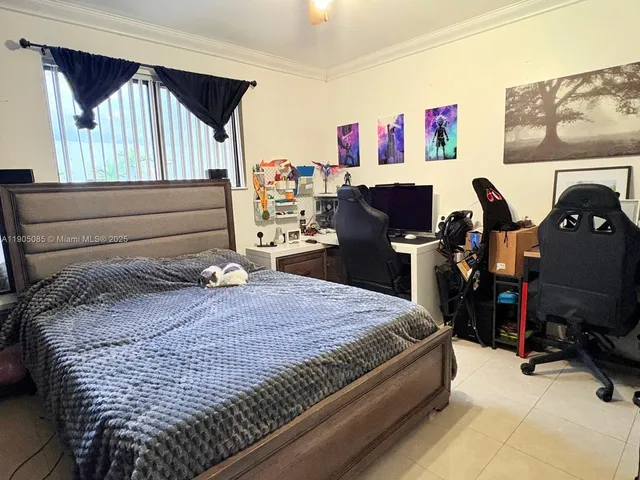 a bed room with a bed and a desk