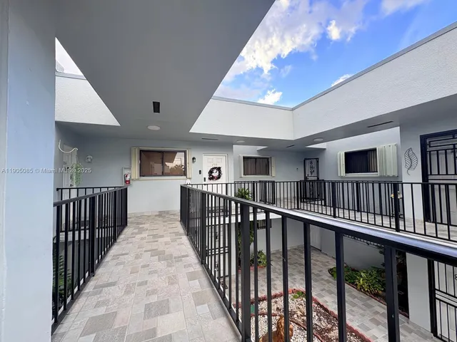a view of a hallway with stairs