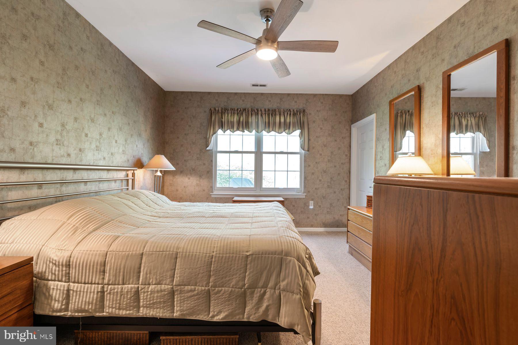 20 Black Eyed Susan Road Langhorne, PA 19047 - Photo 14 of 29 a bedroom with a bed and window