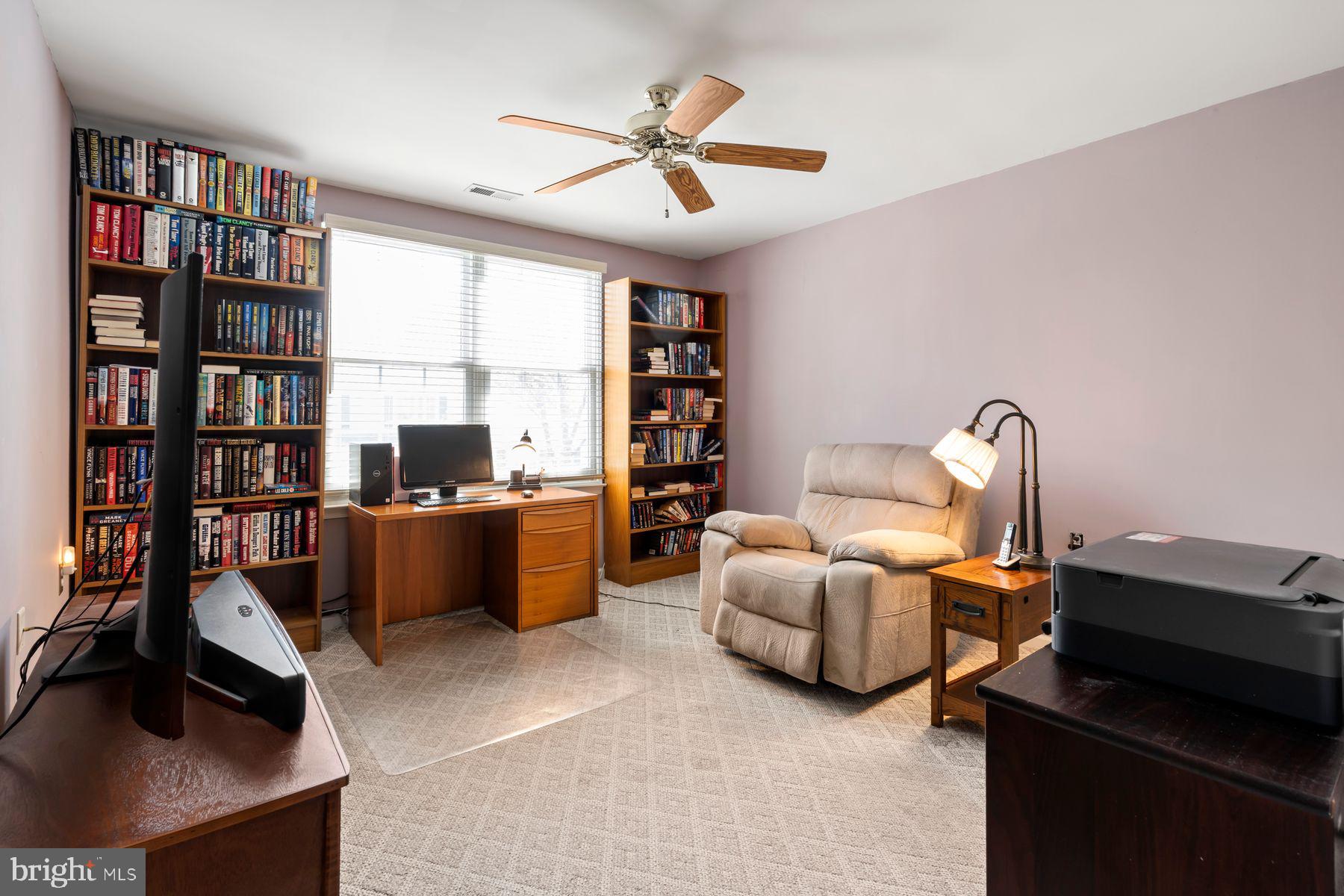 20 Black Eyed Susan Road Langhorne, PA 19047 - Photo 22 of 29 a living room with furniture a book shelf and a window
