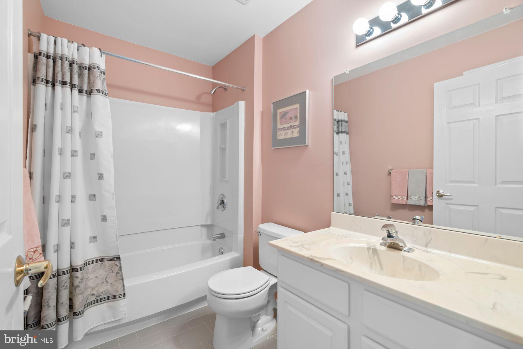 20 Black Eyed Susan Road Langhorne, PA 19047 - Photo 23 of 29 a bathroom with a bathtub shower sink mirror and toilet