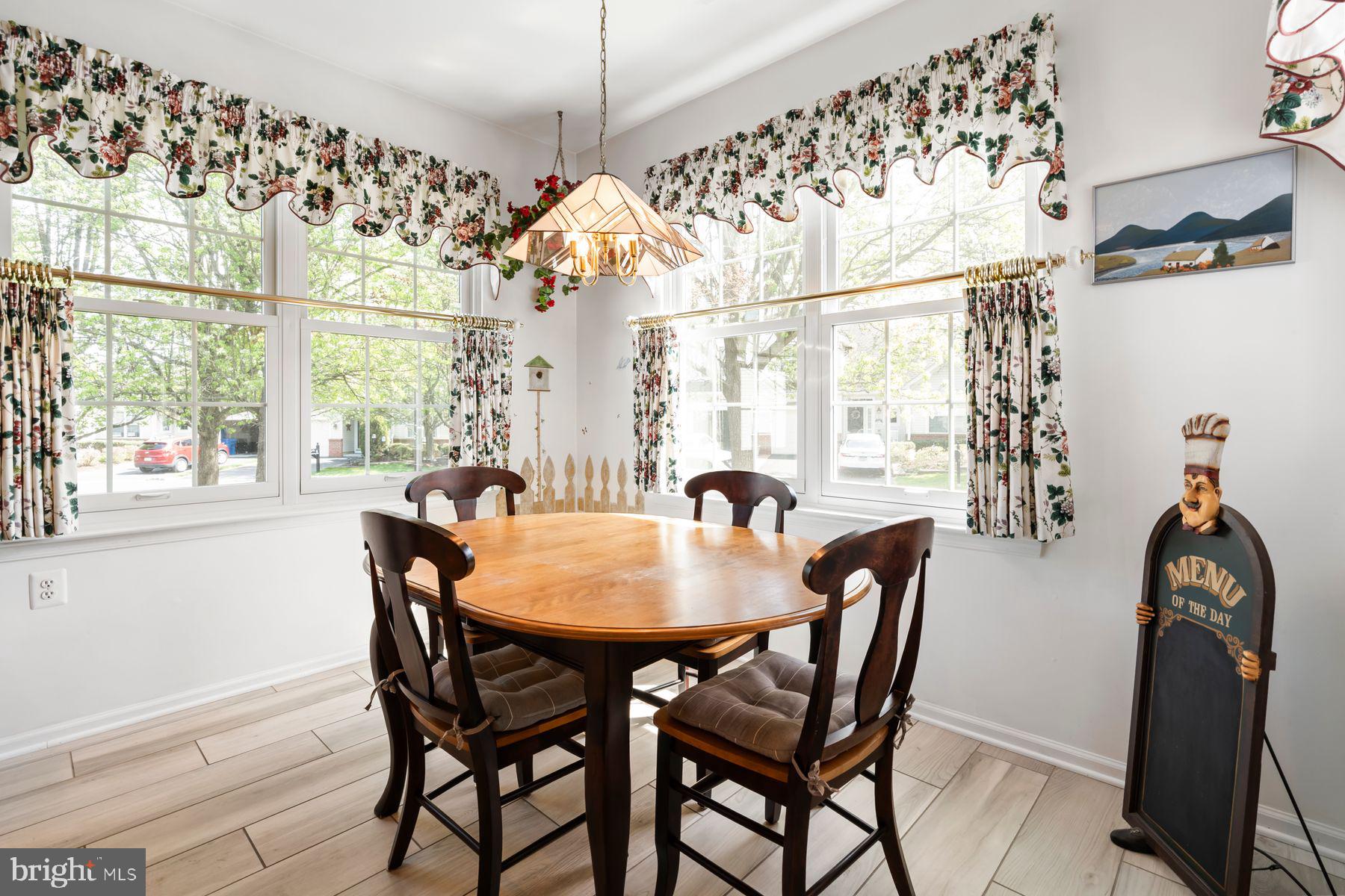 20 Black Eyed Susan Road Langhorne, PA 19047 - Photo 8 of 29 a view of a dining room with furniture and chandelier