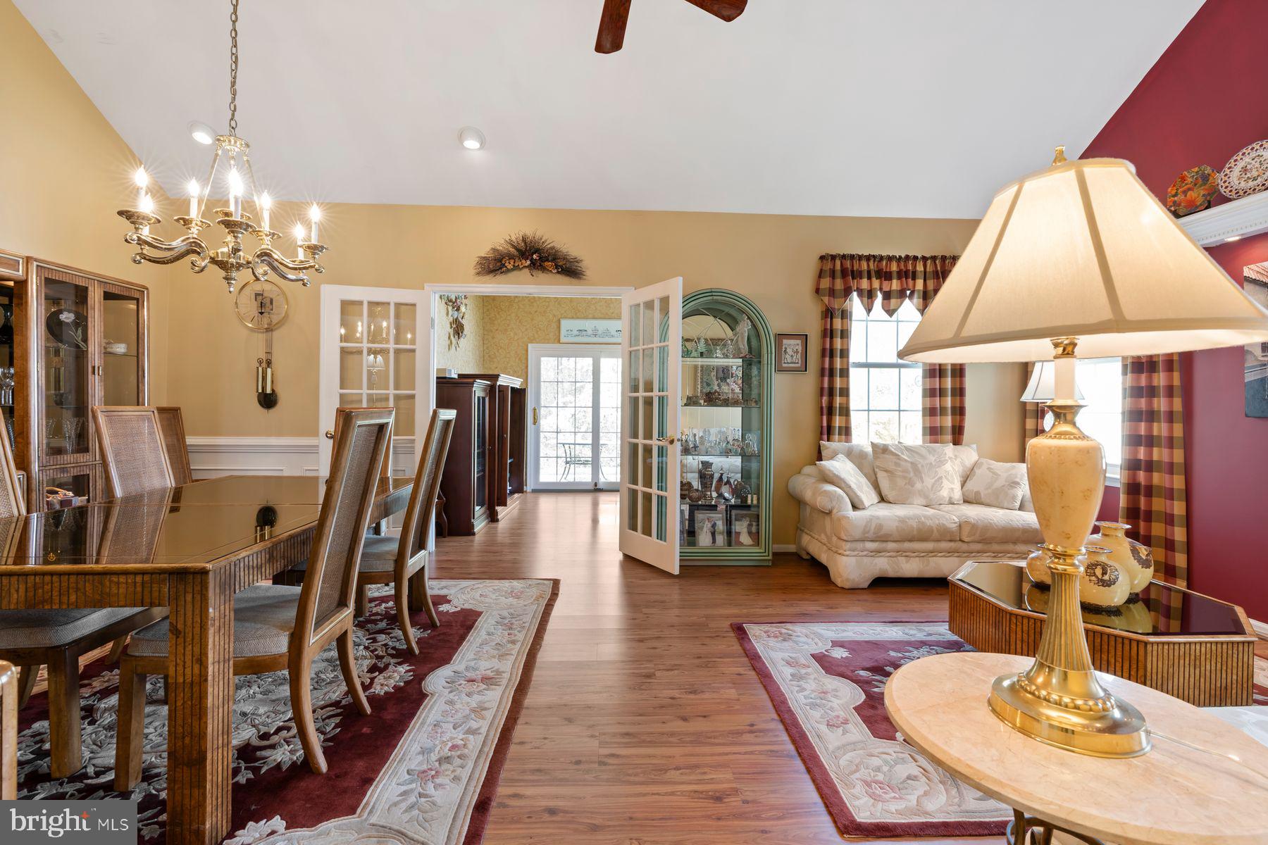 20 Black Eyed Susan Road Langhorne, PA 19047 - Photo 9 of 29 a living room with furniture a chandelier and a dining table