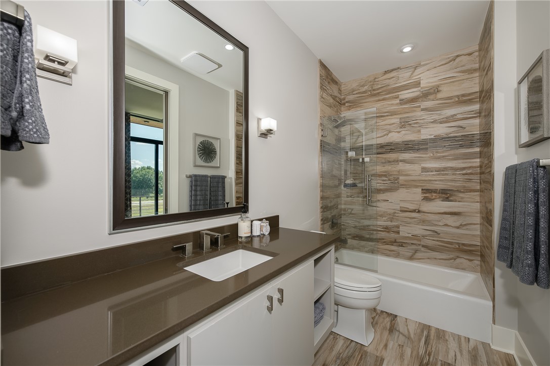 3320 Sycamore Trail Bryan, TX 77807 - Photo 41 of 48 Bathroom featuring toilet, recessed lighting, vanity, and shower / bathtub combination