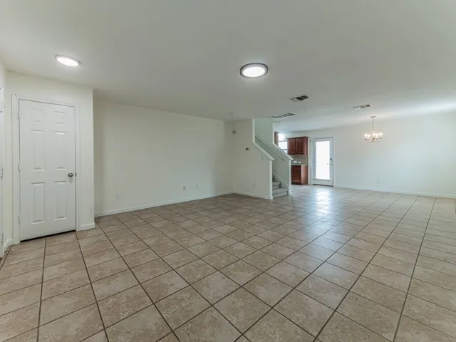 an empty room & glass door space in a room