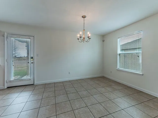 a kitchen with stainless steel appliances granite countertop a sink and a stove