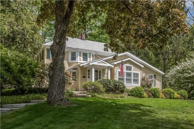 208 Sharp Hill Road Wilton, CT 06897 - Photo 1 of 1 a front view of a house with a yard and trees