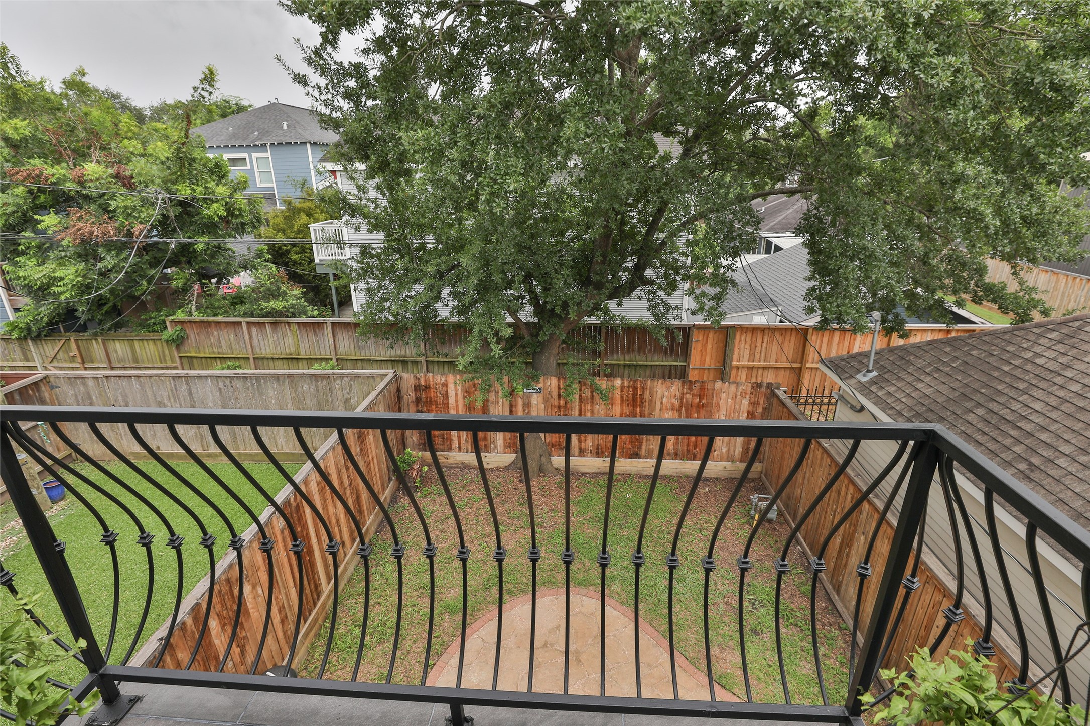 826 East 29th Street Houston, TX 77009 - Photo 20 of 32 Balcony in primary bedroom with a view of the backyard.
