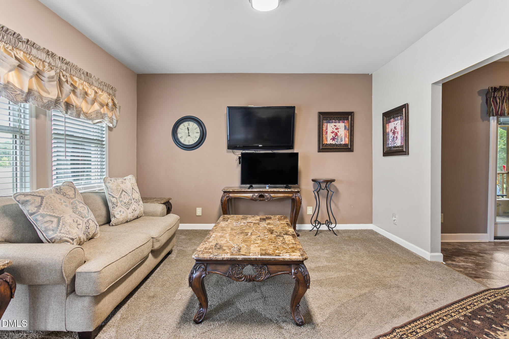 3163 Saul Loop Road Elon, NC 27244 - Photo 7 of 44 a living room with furniture and a flat screen tv