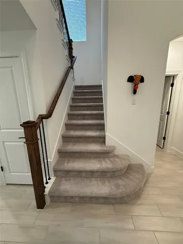 a view of an empty room with a ceiling fan