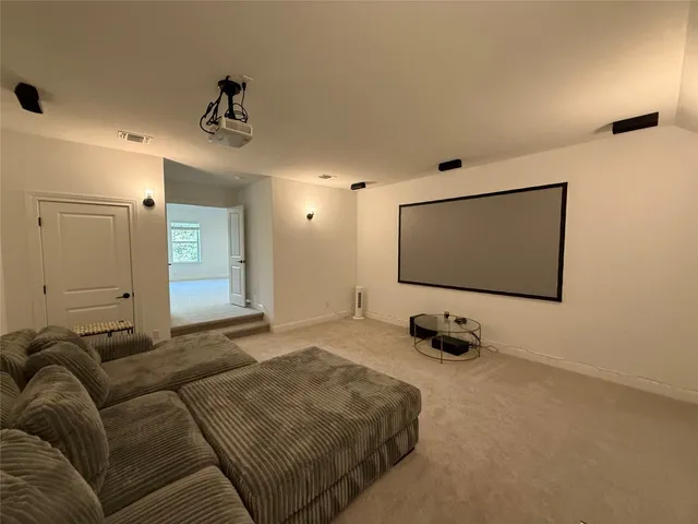 a bathroom with a sink a toilet a mirror and shower