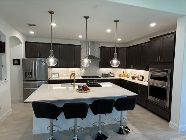 a bathroom with a tub a sink and a mirror