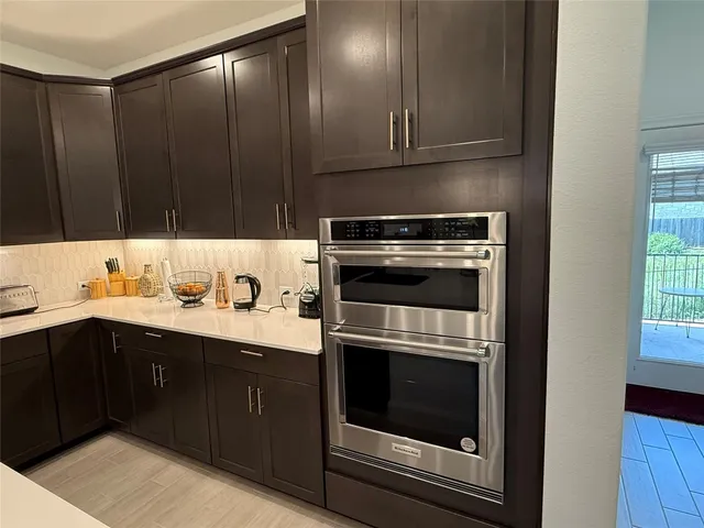 a large bedroom with a large bed and a large window