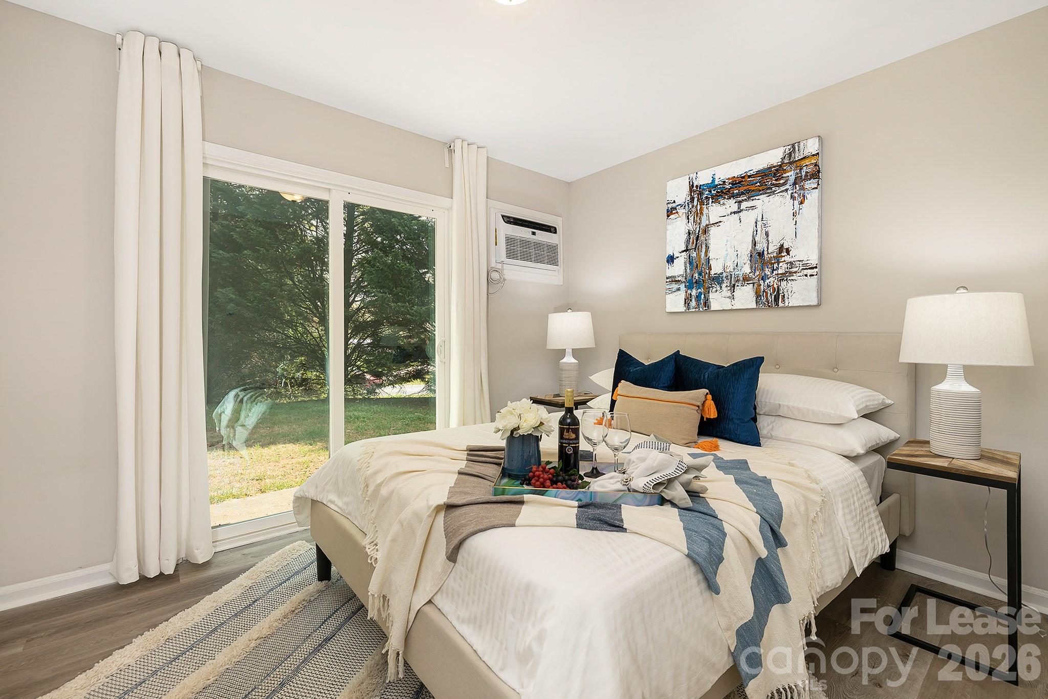 1850 Lowell Bethesda Road, Unit 1 Gastonia, NC 28056 - Photo 7 of 9 a bed room with a bed and a large window