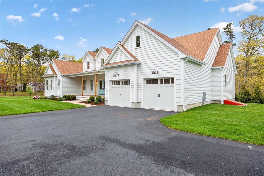 132 Great Western Road Harwich, MA 02645 - Photo 40 of 42 a view of a house with a yard and large tree