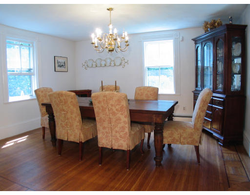1055 Webster Street Needham, MA 02492 - Photo 2 of 7 a view of a dining room with furniture window and wooden floor