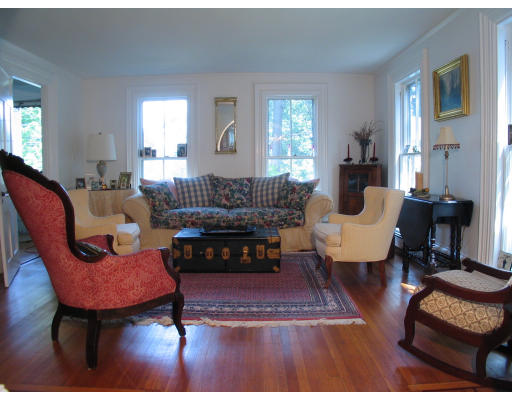 1055 Webster Street Needham, MA 02492 - Photo 4 of 7 a living room with furniture a rug a lamp and a window