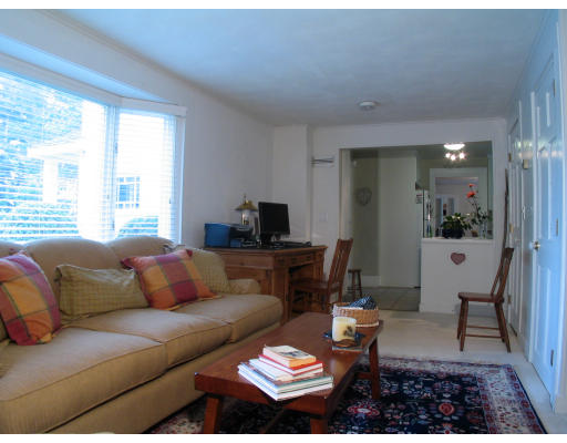 1055 Webster Street Needham, MA 02492 - Photo 6 of 7 a living room with furniture and a large window