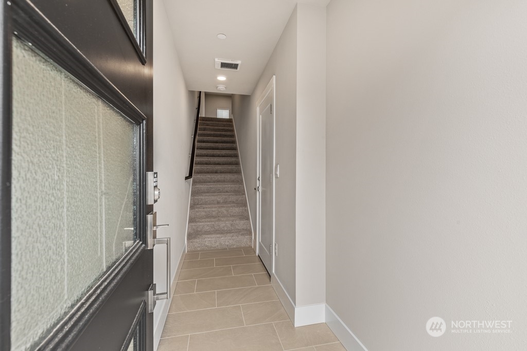 826 238th Place Southeast, Unit B 14 Bothell, WA 98021 - Photo 3 of 32 a view of a hallway with stairs