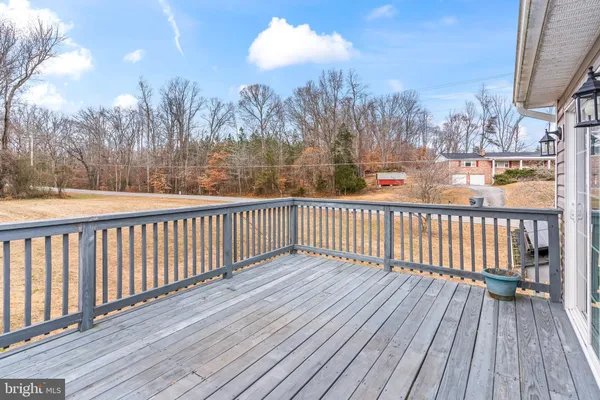 a view of a balcony with wooden floor