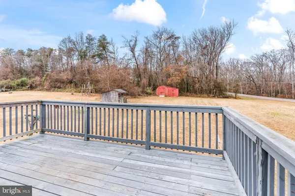 a view of a balcony with wooden fence