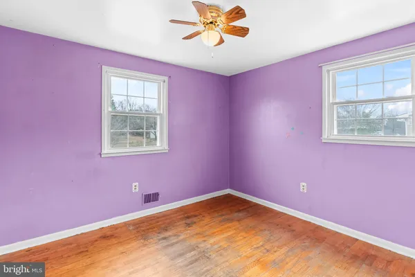 a view of a big room with windows