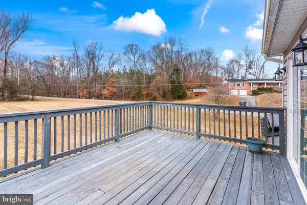 a view of a balcony with wooden floor