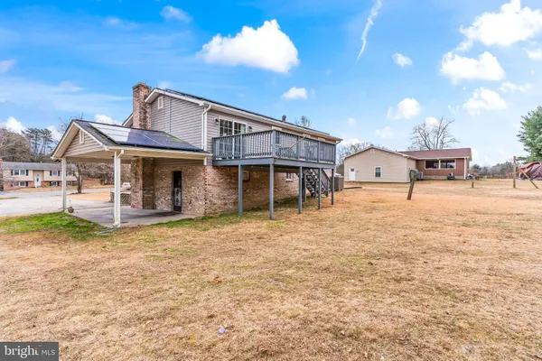 a view of a house with large space and a yard