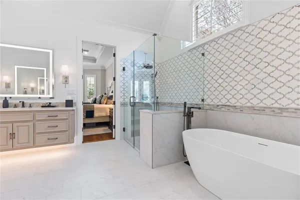 a kitchen with stainless steel appliances granite countertop a sink dishwasher stove and refrigerator