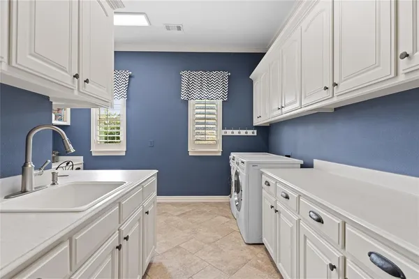 a utility room with cabinets
