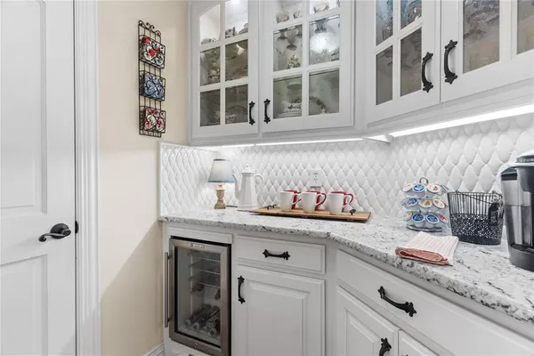a kitchen with stainless steel appliances granite countertop a stove and cabinets