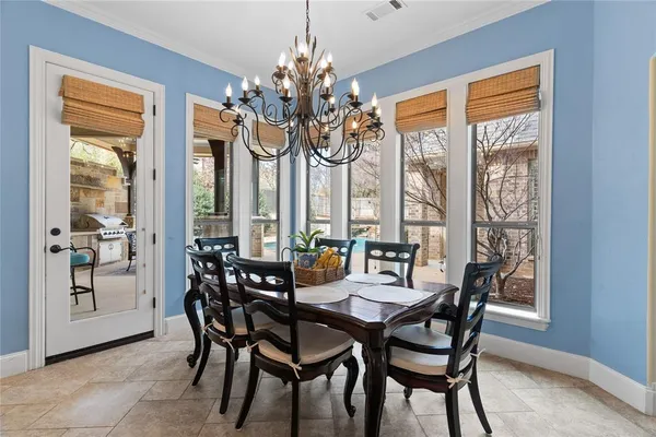 a living room with furniture a flat screen tv and a large window
