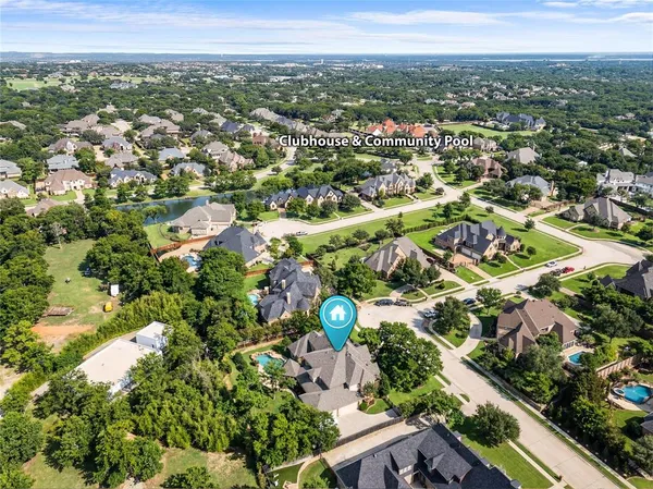 an aerial view of a house with yard
