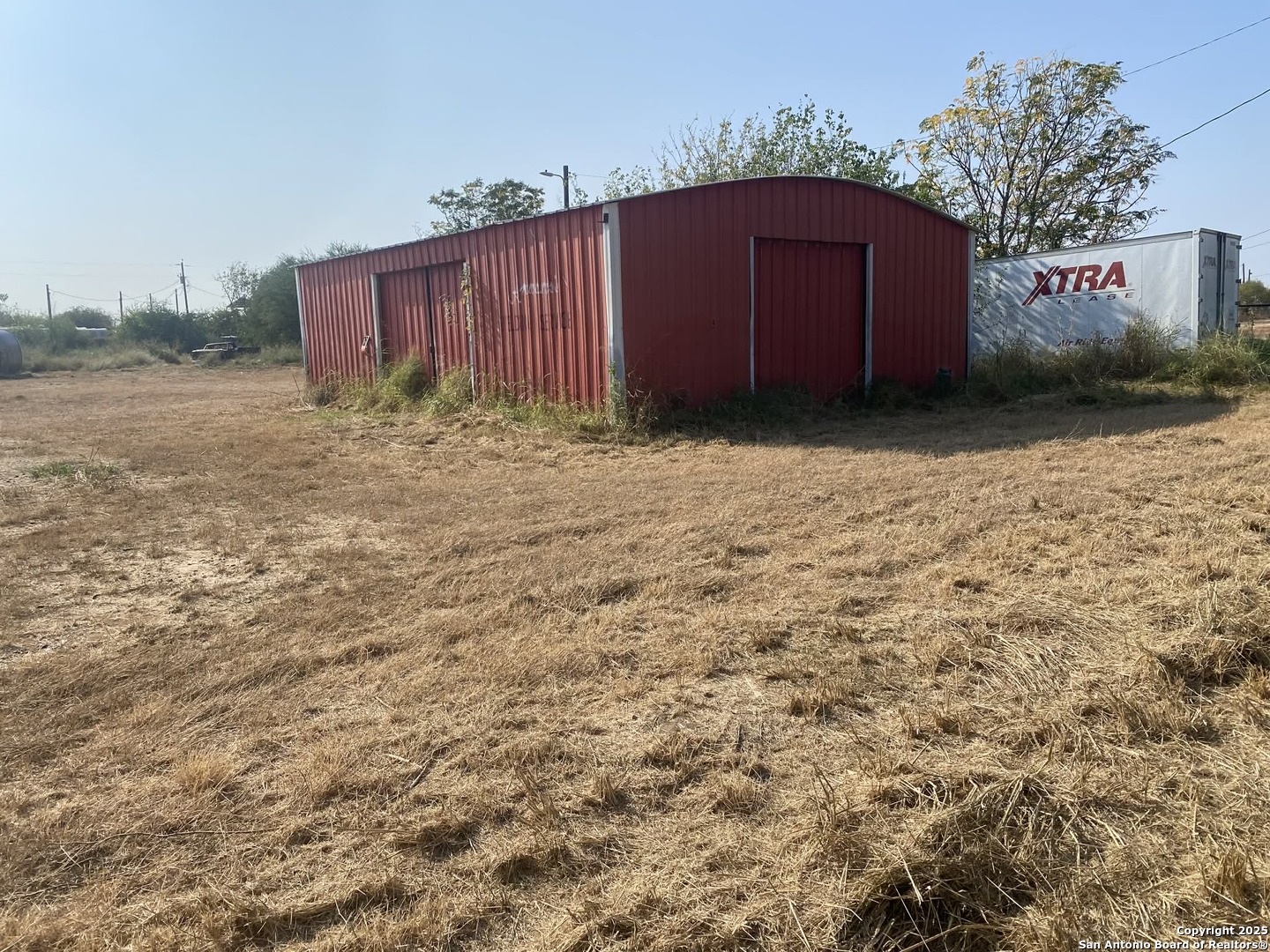 15650 Interstate 35 Dilley, TX 78017 - Photo 6 of 7 a big yard with wooden fence