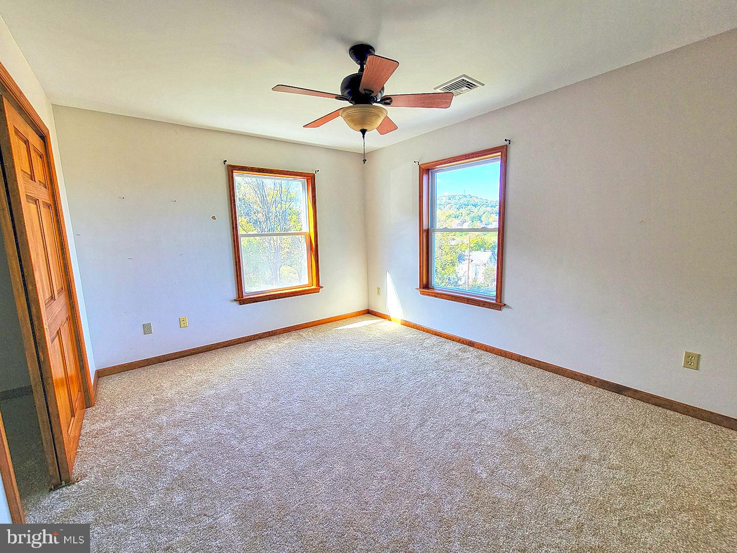 1018 Crestview Avenue Shillington, PA 19607 - Photo 17 of 47 an empty room with windows and ceiling fan