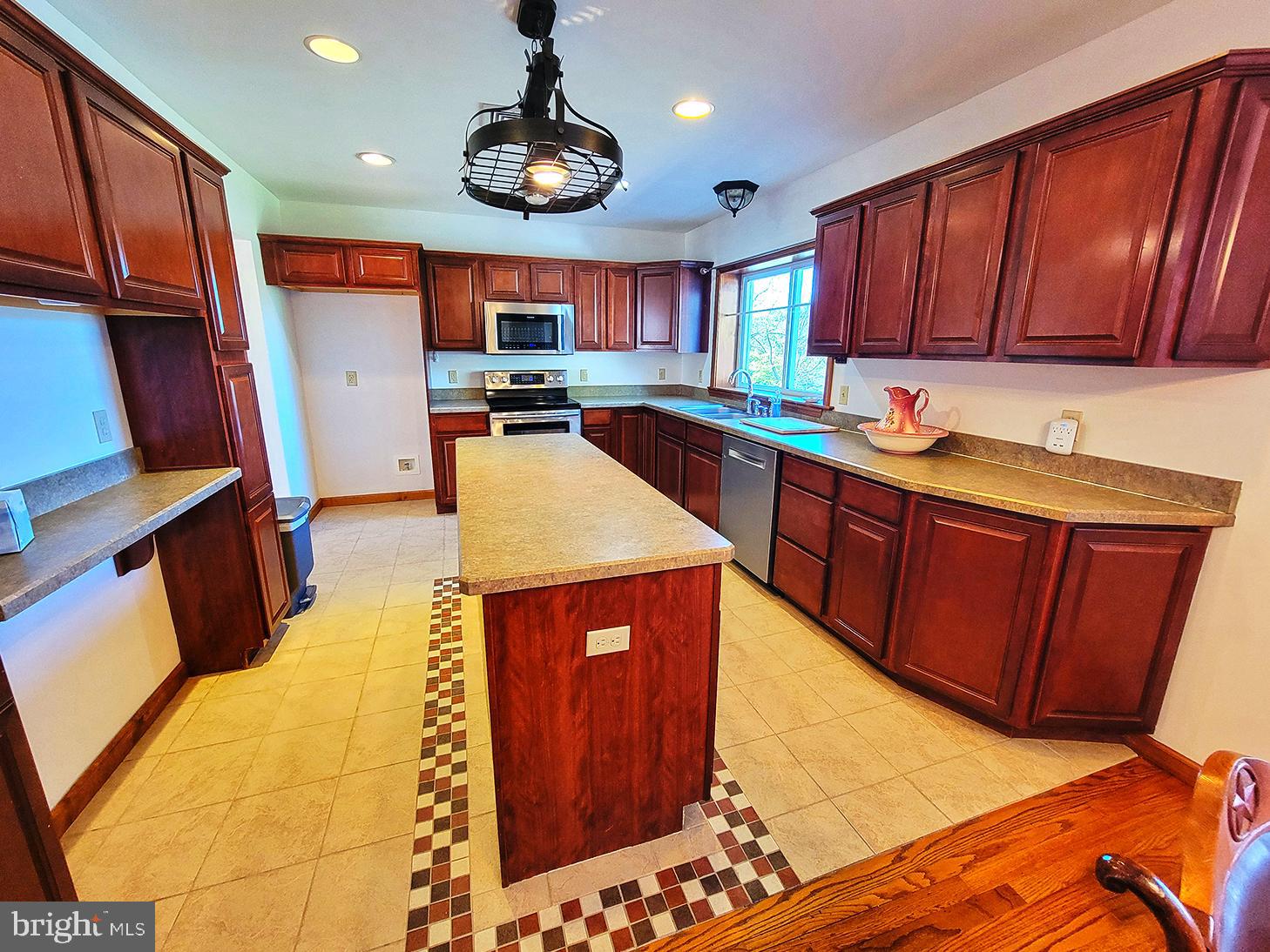 1018 Crestview Avenue Shillington, PA 19607 - Photo 2 of 47 a kitchen with stainless steel appliances wooden cabinets a stove top oven a sink and dishwasher