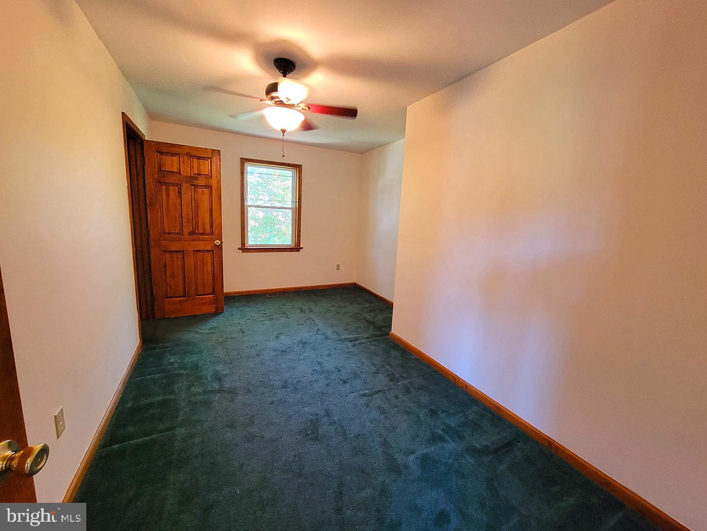 1018 Crestview Avenue Shillington, PA 19607 - Photo 21 of 47 an empty room with chandelier fan and windows