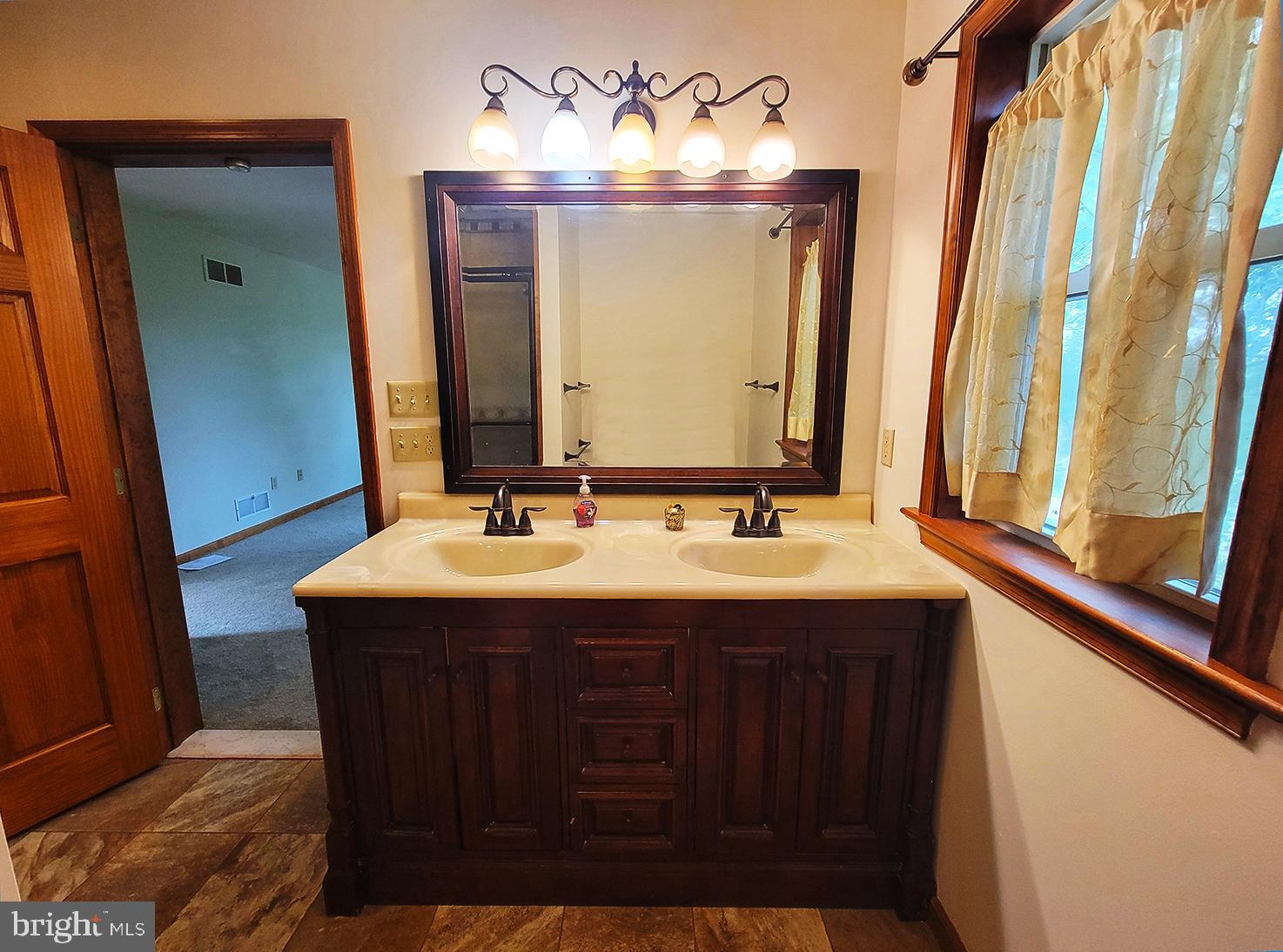 1018 Crestview Avenue Shillington, PA 19607 - Photo 24 of 47 a bathroom with a sink and a mirror