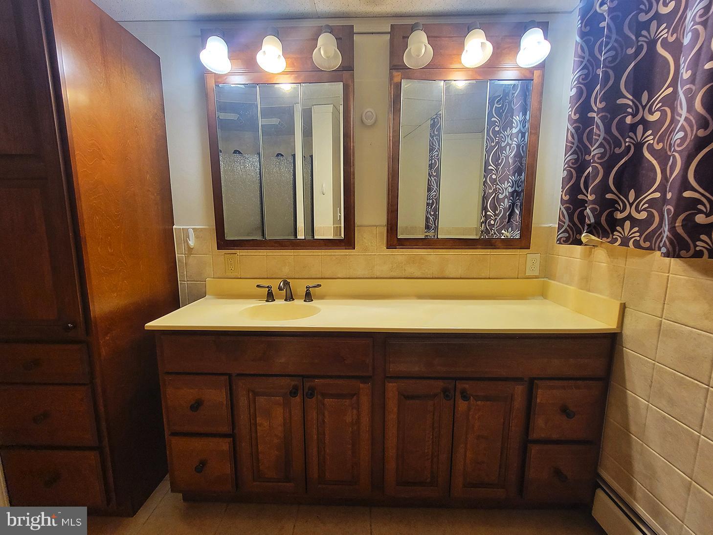 1018 Crestview Avenue Shillington, PA 19607 - Photo 28 of 47 a bathroom with a sink and a mirror
