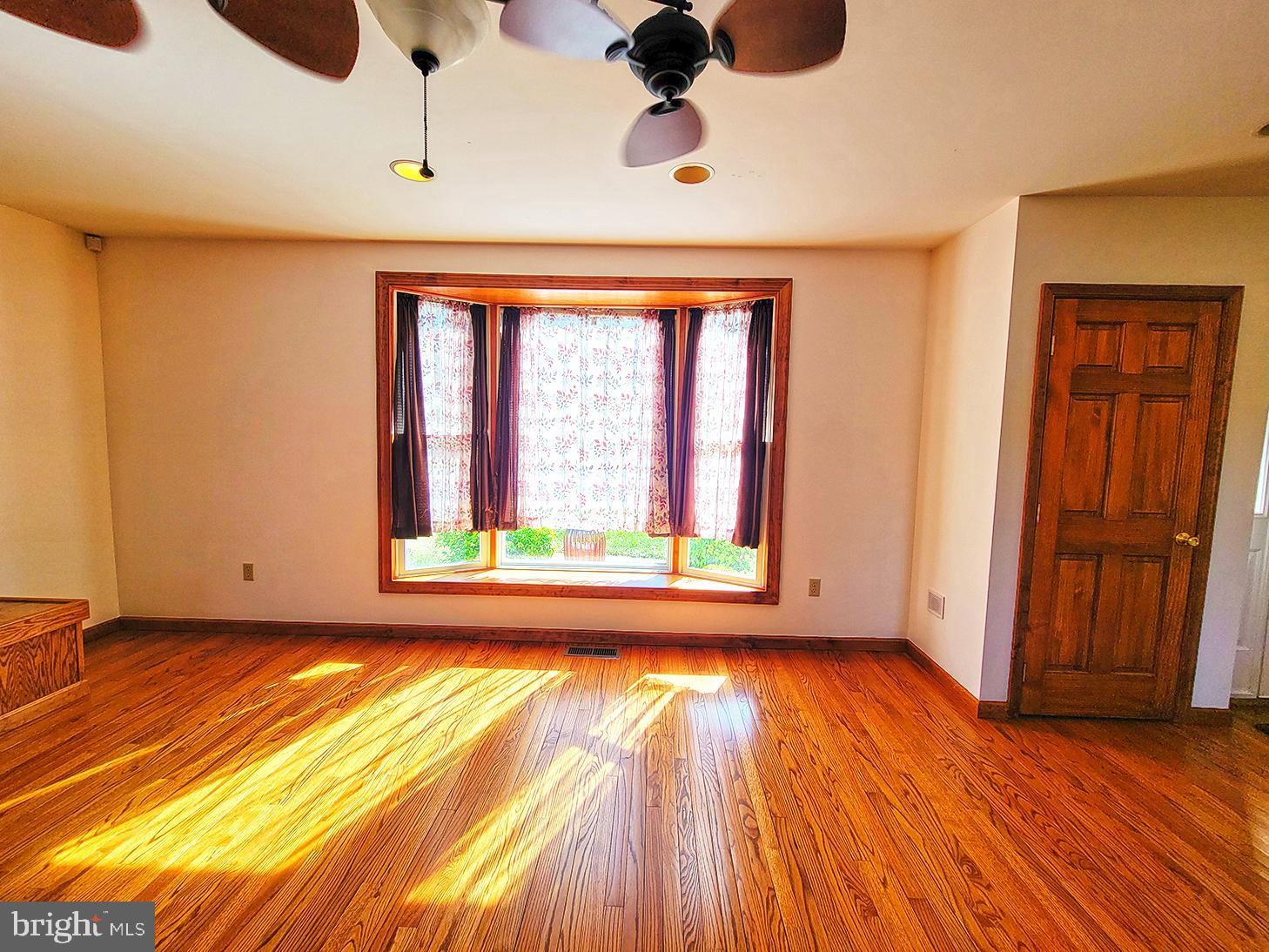 1018 Crestview Avenue Shillington, PA 19607 - Photo 6 of 47 a view of room with wooden floor and windows