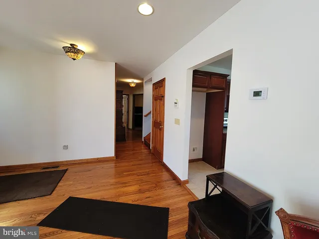 a room with gym equipment and a rug