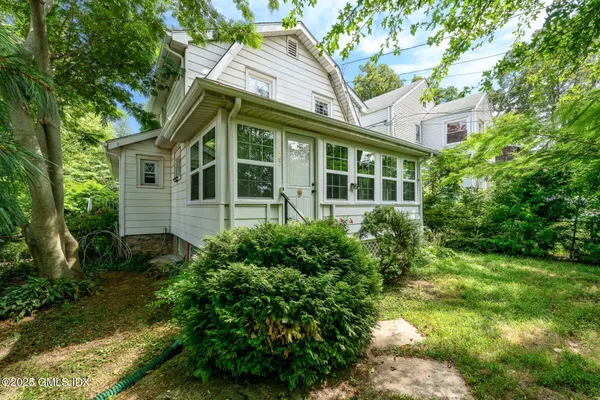 a view of a house with a yard