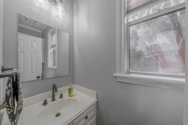 a bathroom with a sink and a mirror