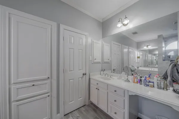 a bathroom with a double vanity sink and a mirror