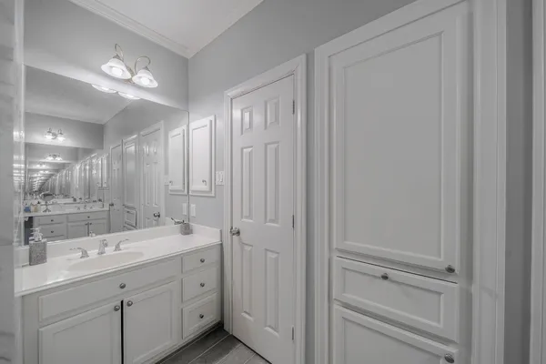 a bathroom with a double vanity sink and mirror