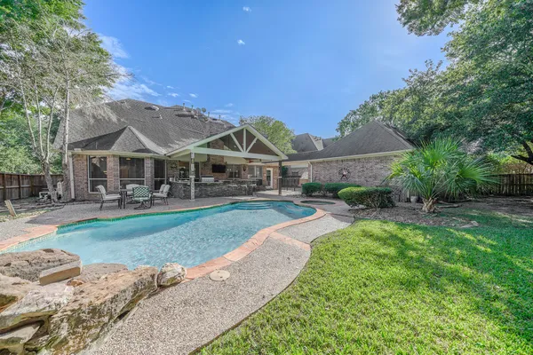 a view of a big yard next to a house