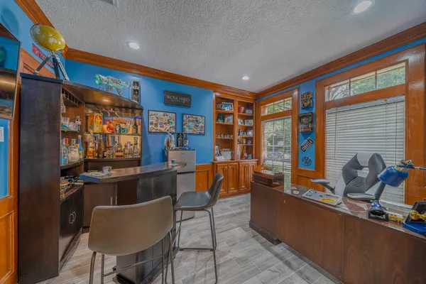 a living room with furniture a rug and a window