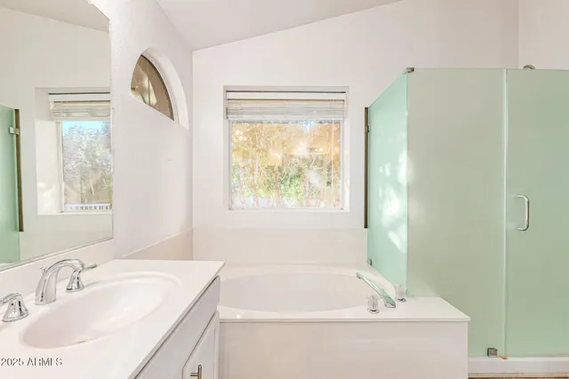 a bathroom with a bathtub and a sink