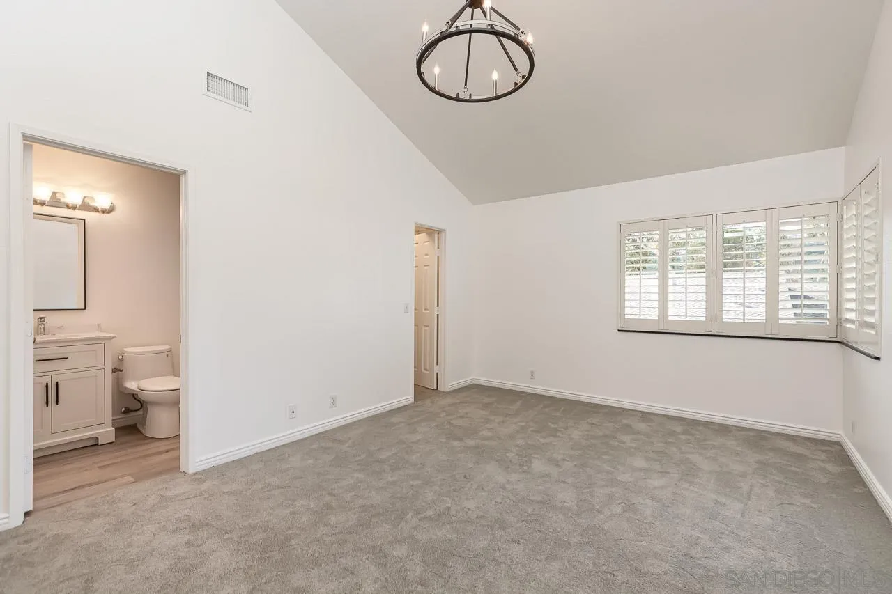 8065 Caminito Gianna La Jolla, CA 92037 - Photo 13 of 27 a view of a room with racks on the wall and a window
