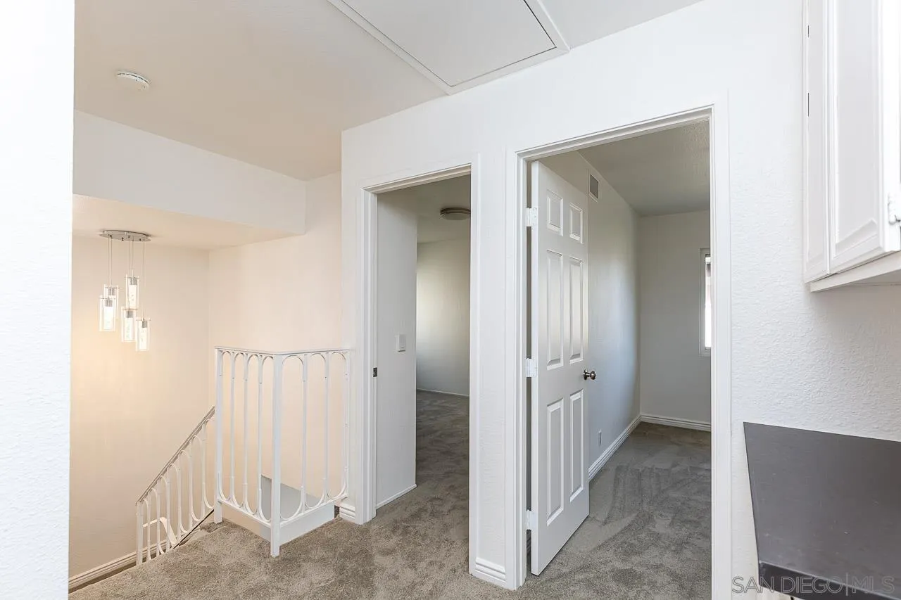8065 Caminito Gianna La Jolla, CA 92037 - Photo 17 of 27 a view of a hallway with closet and bathroom